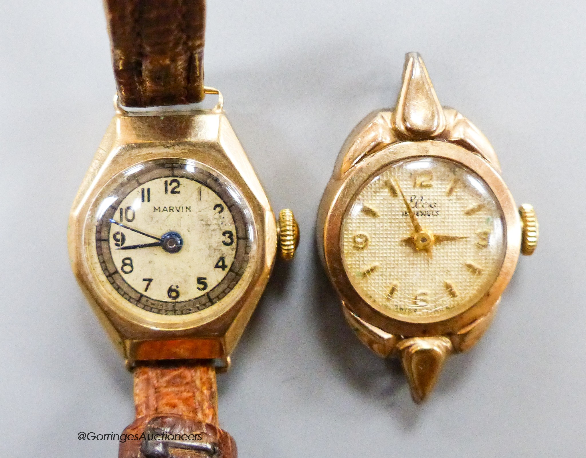 Two lady's 9ct gold cased manual wind wrist watches, including Marvin, one with no strap, gross 18.3 grams.